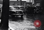 Image of cars moving in heavy rain Saigon Vietnam, 1955, second 25 stock footage video 65675028887