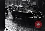 Image of cars moving in heavy rain Saigon Vietnam, 1955, second 26 stock footage video 65675028887