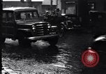 Image of cars moving in heavy rain Saigon Vietnam, 1955, second 27 stock footage video 65675028887