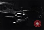 Image of cars moving in heavy rain Saigon Vietnam, 1955, second 28 stock footage video 65675028887