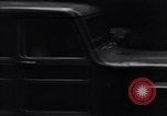 Image of cars moving in heavy rain Saigon Vietnam, 1955, second 29 stock footage video 65675028887