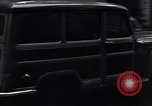 Image of cars moving in heavy rain Saigon Vietnam, 1955, second 30 stock footage video 65675028887