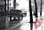 Image of cars moving in heavy rain Saigon Vietnam, 1955, second 32 stock footage video 65675028887