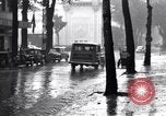 Image of cars moving in heavy rain Saigon Vietnam, 1955, second 33 stock footage video 65675028887