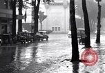 Image of cars moving in heavy rain Saigon Vietnam, 1955, second 35 stock footage video 65675028887