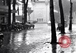 Image of cars moving in heavy rain Saigon Vietnam, 1955, second 36 stock footage video 65675028887