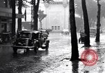 Image of cars moving in heavy rain Saigon Vietnam, 1955, second 37 stock footage video 65675028887