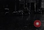 Image of cars moving in heavy rain Saigon Vietnam, 1955, second 38 stock footage video 65675028887
