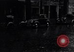 Image of cars moving in heavy rain Saigon Vietnam, 1955, second 39 stock footage video 65675028887