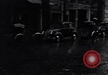 Image of cars moving in heavy rain Saigon Vietnam, 1955, second 40 stock footage video 65675028887