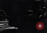 Image of cars moving in heavy rain Saigon Vietnam, 1955, second 42 stock footage video 65675028887