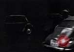 Image of cars moving in heavy rain Saigon Vietnam, 1955, second 43 stock footage video 65675028887