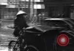 Image of cars moving in heavy rain Saigon Vietnam, 1955, second 50 stock footage video 65675028887