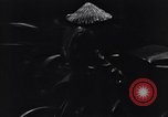 Image of cars moving in heavy rain Saigon Vietnam, 1955, second 52 stock footage video 65675028887