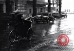 Image of cars moving in heavy rain Saigon Vietnam, 1955, second 54 stock footage video 65675028887