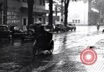 Image of cars moving in heavy rain Saigon Vietnam, 1955, second 55 stock footage video 65675028887