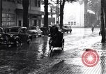 Image of cars moving in heavy rain Saigon Vietnam, 1955, second 56 stock footage video 65675028887