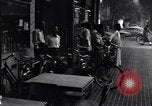 Image of cars moving in heavy rain Saigon Vietnam, 1955, second 60 stock footage video 65675028887