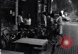 Image of cars moving in heavy rain Saigon Vietnam, 1955, second 61 stock footage video 65675028887