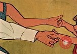 Immagine di Giovane con un neonato United States USA, 1964, secondo 51 filmato di repertorio 65675029102