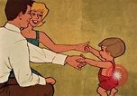 Immagine di Giovane con un neonato United States USA, 1964, secondo 54 filmato di repertorio 65675029102