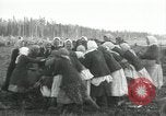 Image of Russian women work removing stumps Archangel Russia, 1918, second 43 stock footage video 65675029280