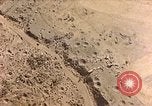 Image of shoreline Iwo Jima, 1945, second 1 stock footage video 65675029313