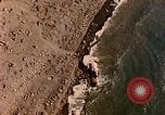 Image of shoreline Iwo Jima, 1945, second 21 stock footage video 65675029313