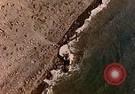 Image of shoreline Iwo Jima, 1945, second 23 stock footage video 65675029313