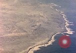 Image of shoreline Iwo Jima, 1945, second 36 stock footage video 65675029313