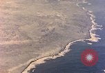 Image of shoreline Iwo Jima, 1945, second 40 stock footage video 65675029313