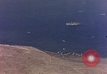Image of shoreline Iwo Jima, 1945, second 49 stock footage video 65675029313