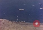 Image of shoreline Iwo Jima, 1945, second 50 stock footage video 65675029313