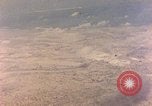 Image of shoreline Iwo Jima, 1945, second 52 stock footage video 65675029313