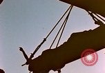 Image of Iwo Jima wounded hoisted onto LST Iwo Jima, 1945, second 5 stock footage video 65675029321