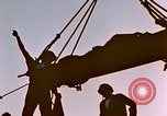 Image of Iwo Jima wounded hoisted onto LST Iwo Jima, 1945, second 6 stock footage video 65675029321