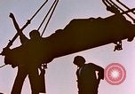 Image of Iwo Jima wounded hoisted onto LST Iwo Jima, 1945, second 7 stock footage video 65675029321