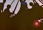 Image of Iwo Jima wounded hoisted onto LST Iwo Jima, 1945, second 9 stock footage video 65675029321