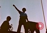 Image of Iwo Jima wounded hoisted onto LST Iwo Jima, 1945, second 13 stock footage video 65675029321