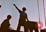 Image of Iwo Jima wounded hoisted onto LST Iwo Jima, 1945, second 14 stock footage video 65675029321