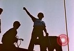 Image of Iwo Jima wounded hoisted onto LST Iwo Jima, 1945, second 15 stock footage video 65675029321