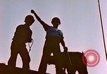 Image of Iwo Jima wounded hoisted onto LST Iwo Jima, 1945, second 16 stock footage video 65675029321
