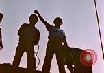Image of Iwo Jima wounded hoisted onto LST Iwo Jima, 1945, second 17 stock footage video 65675029321