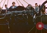 Image of Iwo Jima wounded hoisted onto LST Iwo Jima, 1945, second 21 stock footage video 65675029321