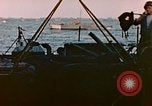 Image of Iwo Jima wounded hoisted onto LST Iwo Jima, 1945, second 23 stock footage video 65675029321