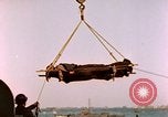 Image of Iwo Jima wounded hoisted onto LST Iwo Jima, 1945, second 30 stock footage video 65675029321