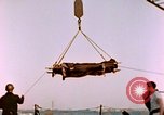 Image of Iwo Jima wounded hoisted onto LST Iwo Jima, 1945, second 33 stock footage video 65675029321