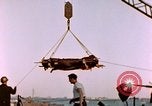 Image of Iwo Jima wounded hoisted onto LST Iwo Jima, 1945, second 34 stock footage video 65675029321