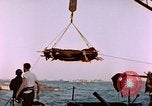 Image of Iwo Jima wounded hoisted onto LST Iwo Jima, 1945, second 35 stock footage video 65675029321