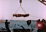 Image of Iwo Jima wounded hoisted onto LST Iwo Jima, 1945, second 36 stock footage video 65675029321